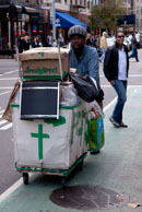 New York street vendor / Street vendor wheeling his cart in New York