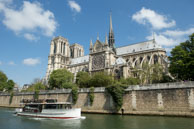 Notre Dame and River Boat / River boat passing Notre Dame