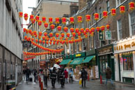 Chinatown Street / Red Chinese Lanterns hanging over a street in Chinatown on Chinese New Year’s Day