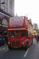 London Bus / London Bus with children celebrating the Chinese New Year at the end of the parade