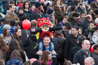 Young Boy as a Lion / Young boy with a lion costume on a man's shoulders in Trafalgar Sqaure during the Chinese New Year celebrations