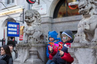 Two boys - Two lions / Two young boys sitting between two stone Chinese lions on Gerrard Street, London