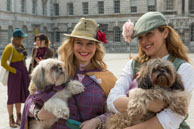 Tweed Ladies & Dogs / Two ladies holding two small dogs which accompanied them on The Tweed Run
