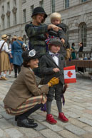 Tweed Children / Two children dressed in tweed with Canadian and UK flags