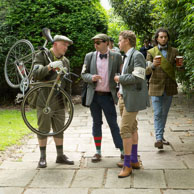 Carrying his Bike / Tweed Run rider is carrying his bike whilst others partake in refreshments at the end of the Tweed Run