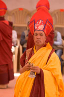 Monk with bell / An monk performing religous ceremony at the festival