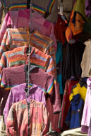 Clothing in Leh / Colourful sweaters hanging on a stall in Leh