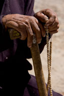 Hands & beads / An old man holding his walking stick and beads