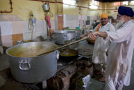 Cooking curry / Cooking cuury in kitchen at Gurdwara Sis Ganj Sahib on Chandni Chowk