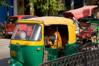 Woman in Tuktuk / Tuktuk in Delhi carrying a brightly dressed woman
