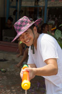 Local shooting water gun / Religious procession for Lao New Year in Luang Prabang and following celebrations