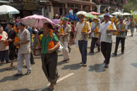 Flowers being carried / Religious procession for Lao New Year in Luang Prabang and following celebrations