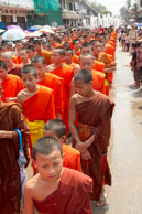 Last of monks in procession / Religious procession for Lao New Year in Luang Prabang and following celebrations