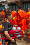 Water gun in front of monks / Religious procession for Lao New Year in Luang Prabang and following celebrations