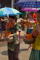 More flowers being carried / Religious procession for Lao New Year in Luang Prabang and following celebrations