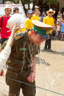 Soaked policeman / Religious procession for Lao New Year in Luang Prabang and following celebrations