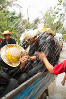 On a truck taking a soaking / Religious procession for Lao New Year in Luang Prabang and following celebrations