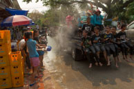 Water fight in afternoon sun / Religious procession for Lao New Year in Luang Prabang and following celebrations