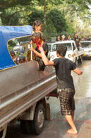 Red face paint? / Religious procession for Lao New Year in Luang Prabang and following celebrations