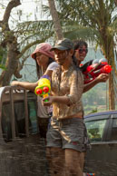 Shooting from an opened van / Religious procession for Lao New Year in Luang Prabang and following celebrations