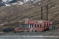 Old disused building near the Pyramiden dock / Pyramiden, an abandoned Russian mining settlement