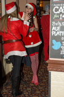 Santas (2014-023) / London Santas were raising money for the St Christopher's Hospice in South London and having a few drinks around Pimlico.