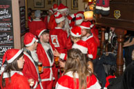 Santas (2014-024) / London Santas were raising money for the St Christopher's Hospice in South London and having a few drinks around Pimlico.