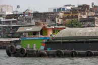 Floating cargo / Close up of a cargo boat along the river in Bangkok