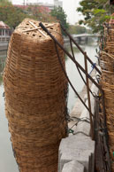 Fishing Baskets / Stacked fishing baskets beside the river