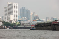 Cargo in Bangkok / Transporting cargos along the river in Bangkok