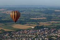 Over the Village / Balloon flying over the village