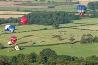 Popular Landing Spot / Large open landing area sees a number of balloons landing together