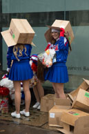 Sheltering Cheerleaders / Prior to the 2014 London New Year's Day Parade, US Cheerleaders sheltering from the rain