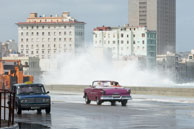 Getting wet on on the Malecón / The sea breaks over the road along the Malecón in Havana, Cuba