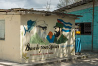 Hemmingway meets Castro / A painting the side of a building at the fishing port in Cojimar depicts Ernest Hemmingway and Fidel Castro