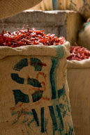 Sacks of chillis / Bright red chillis stored in sacks in the spice market in Old Delhi