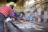 Cooking breads / Cooking breads in kitchen at Gurdwara Sis Ganj Sahib on Chandni Chowk