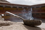 Burning incense / An offerring of incense buring in the courtyard outside of a temple