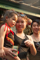 Young family / Religious procession for Lao New Year in Luang Prabang and following celebrations