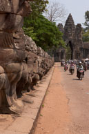 Statue lined bridge / Temples, their surrounding and people in Seim Reap, Cambodia