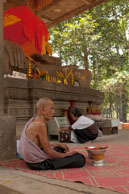 Old man watching offerrings / Temples, their surrounding and people in Seim Reap, Cambodia