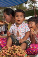 Young family on food stall / Temples, their surrounding and people in Seim Reap, Cambodia