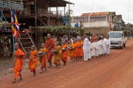 Parading monks / Experiences when travelling through villages in Cambodia