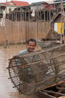 Man with fishing trap / Experiences when travelling through villages in Cambodia