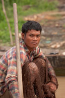 Boy with fishing net / Experiences when travelling through villages in Cambodia