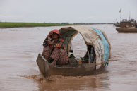 Woman at bow / Experiences when travelling through villages in Cambodia