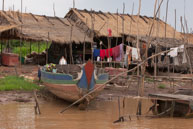 Fishing boat at house / Experiences when travelling through villages in Cambodia