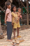 Three young children / Experiences when travelling through villages in Cambodia