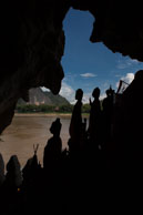 Retired Buddhas / Just outside Laung Prabang (Laos), there is a cave where retired statues of Buddha are kept