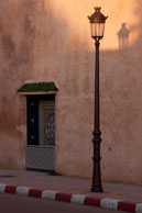 Evening in Meknes / Lamp post and its shade on a road in Meknes one evening